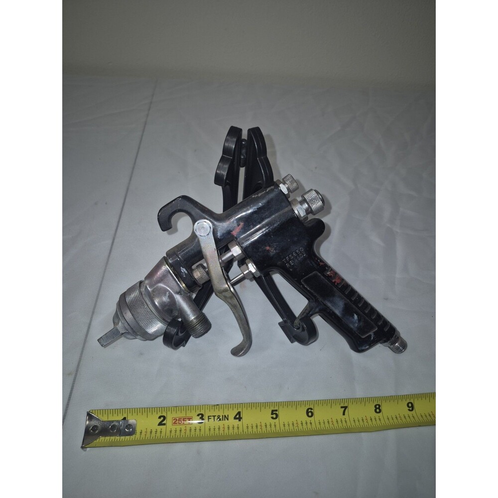 Pre-owned TFS650 RE-603 pressure feed paint spray gun. Made in Taiwan